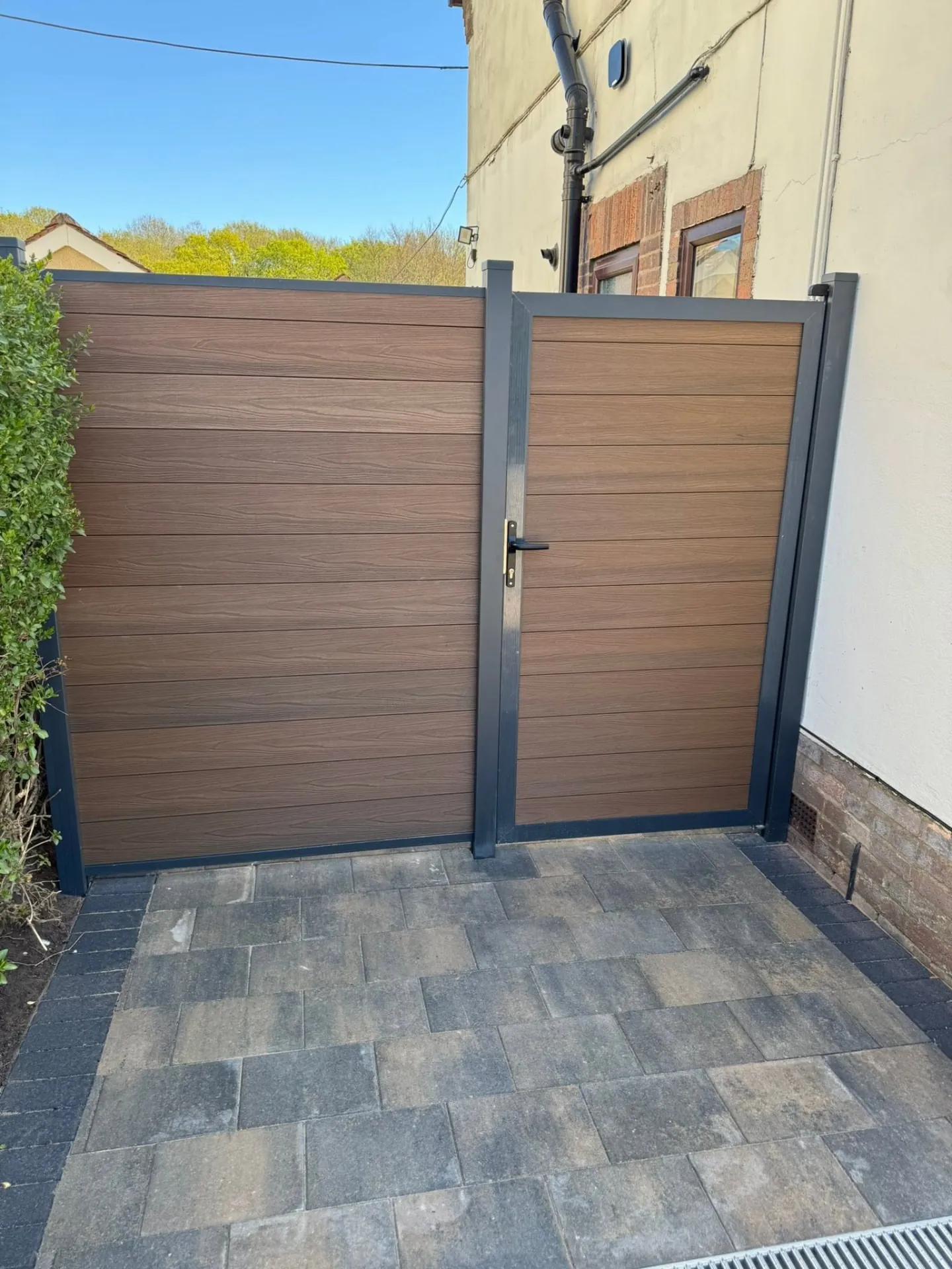 Composite gate and matching fence with dark framing