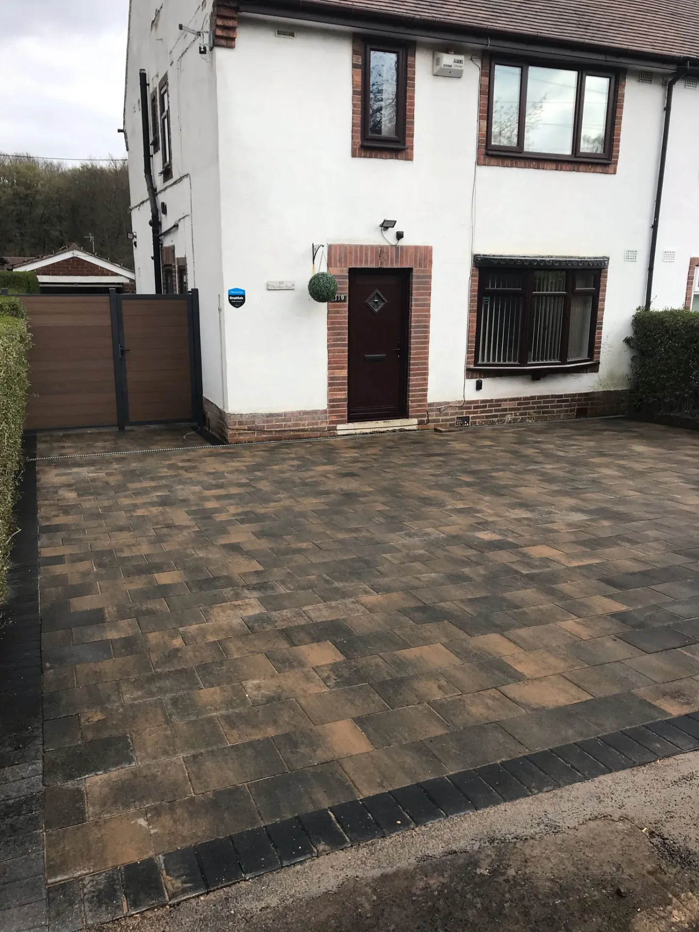 Block paved driveway in front of a house